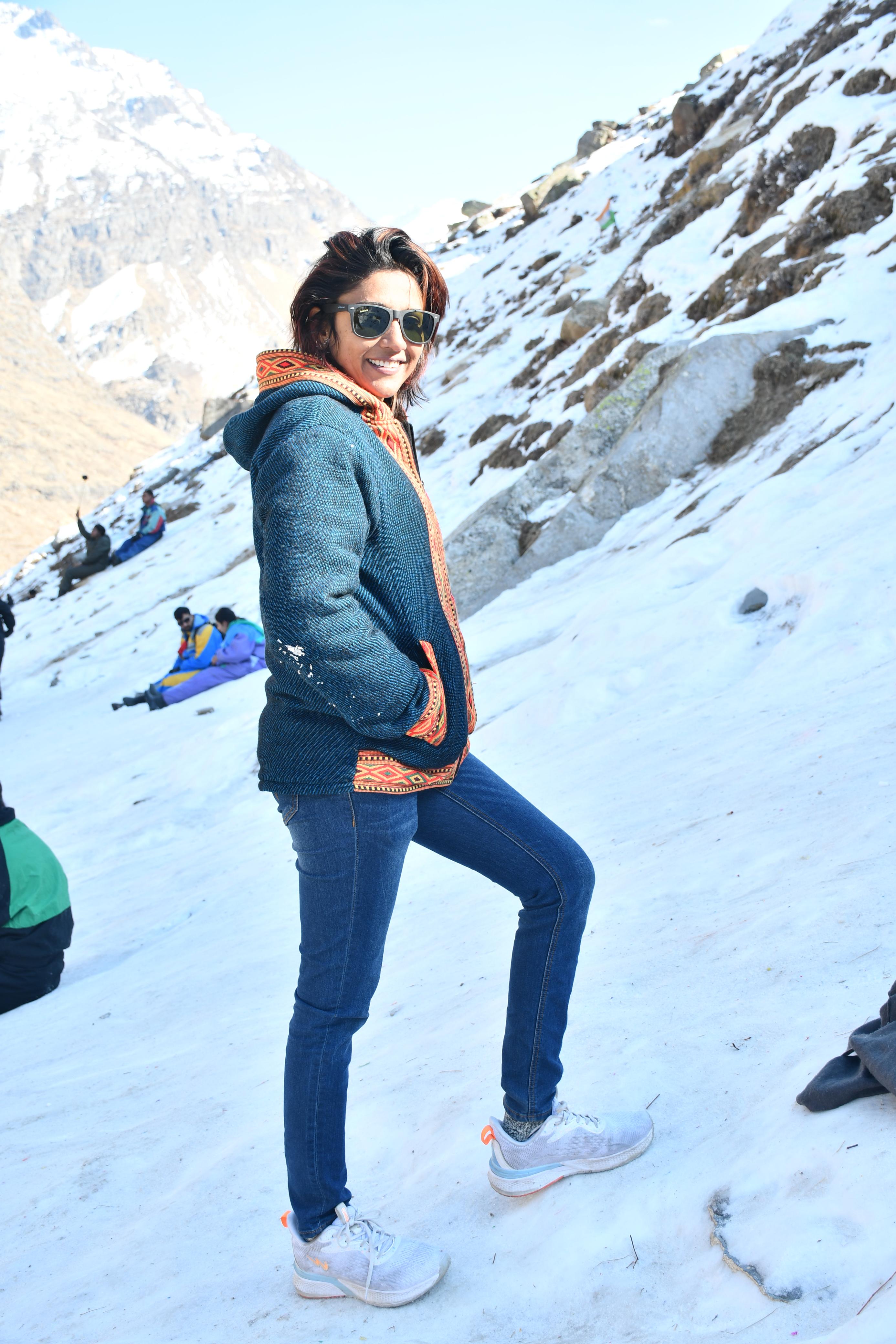 Suneha in snow with shades and winter jacket